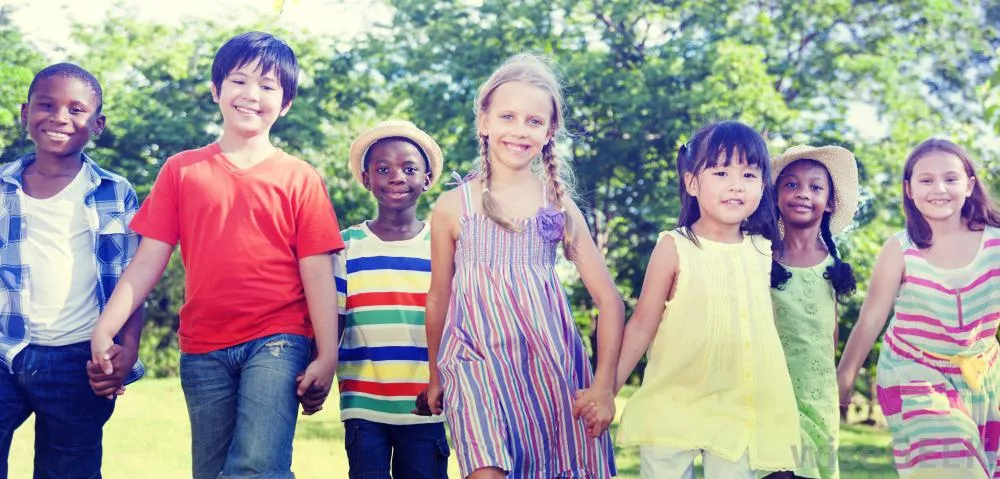 children-holding-hands-outdoors
